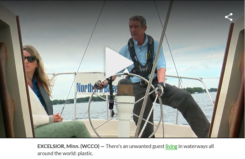 Northern Breezes' Les Mann with WCCO crew aboard Adagio, Lake Minnetonka.