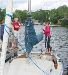Natalie Tebben, former Camp Director, presents an “Afloat Teaching Topic” to her fellow instructor candidates as part of her Basic Keelboat Instructor certification.
