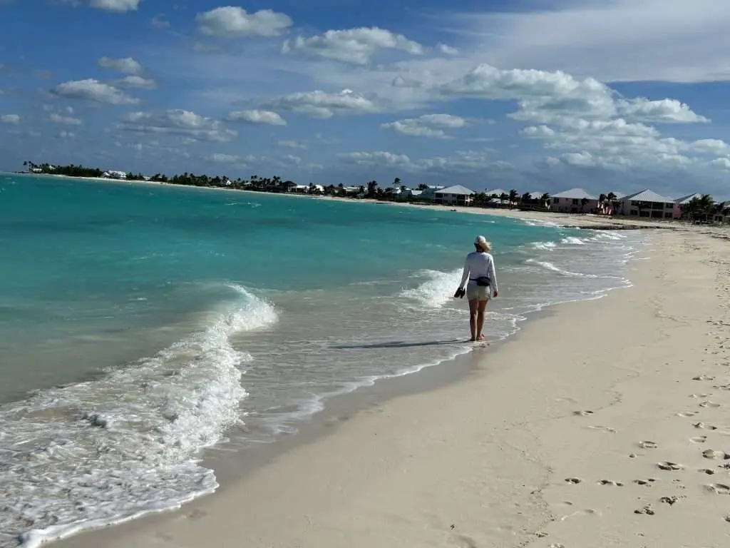Strolling a white sand beach on Treasure Cay