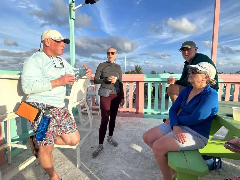Catamaran sailors relax at Nipper’s Beach Bar and Grill on Great Guana Cay in the Abaco Sea.